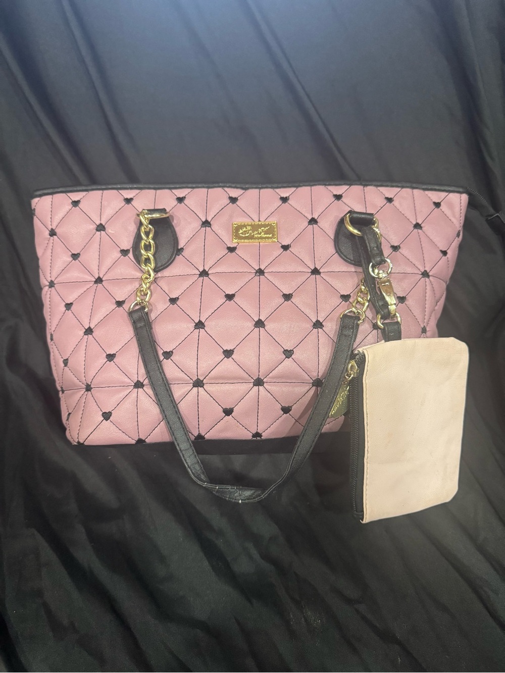 This is a Luv Betsey by Betsey Johnson pink quilted faux leather